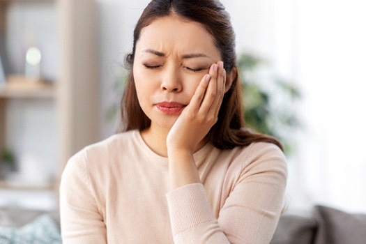 Closeup of woman experiencing toothache