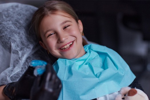 Young patient in Argyle smiling in dental chair