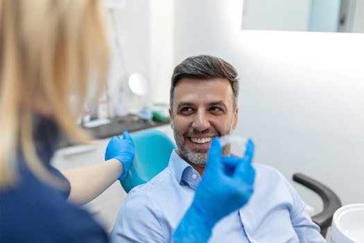 Patient in Argyle smiling as Invisalign aligners