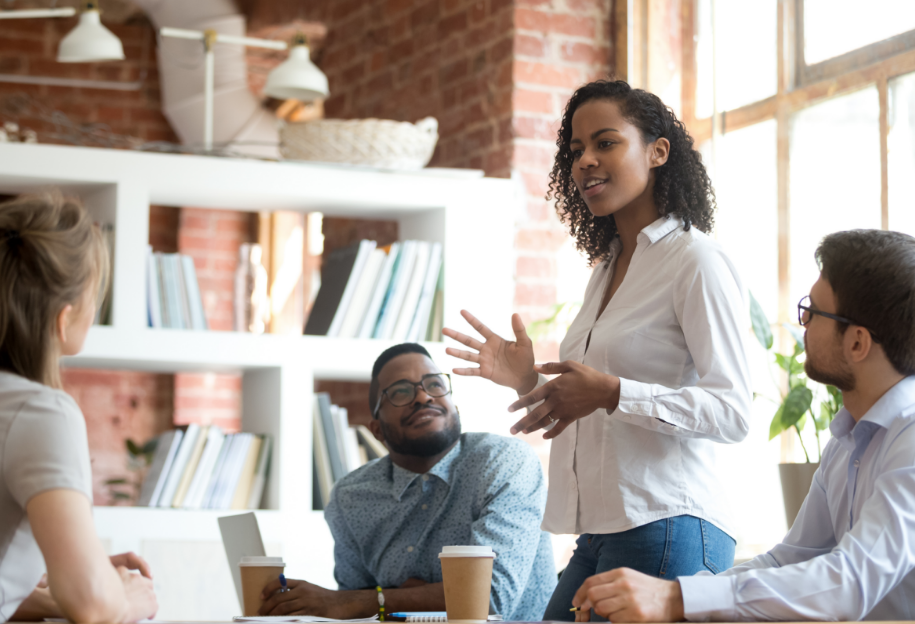 Woman speaking at meeting in office
