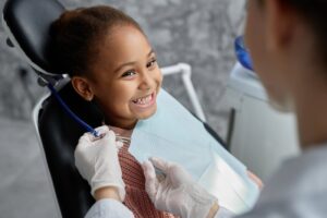 Little girl smiling after getting her tongue-tie treated