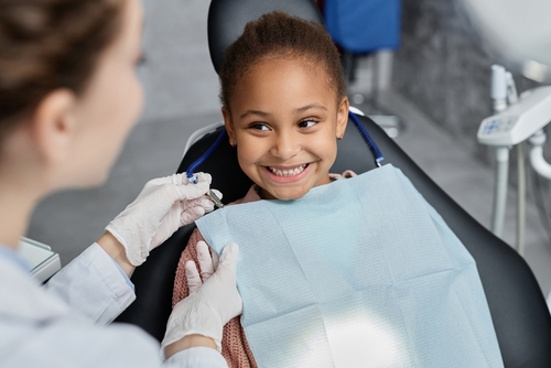 little girl at the dentist